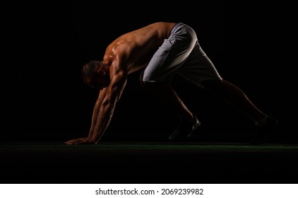 Topless And Handsome Male Is Getting Up From The Ground To Take A Break