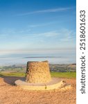 The topograph or toposcope at the top of the Wrekin hill in Shropshire, UK with low laying mist over the countryside