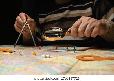 A topographer sits at