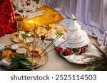 A topor is a type of conical headgear, made of white sholapith, traditionally worn by grooms as part of the Bengali Hindu wedding ceremony. Bengali wedding rituals, puja arrangement background