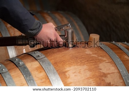 topping up wine barrels domaine pommard cote de beaune burgundy france