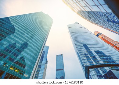 Tops of modern corporate buildings against the gloomy sky. high-rise buildings and skyscrapers Moscow International Business Center (Moscow City), Russia. City view from the bottom up - Shutterstock ID 1576193110
