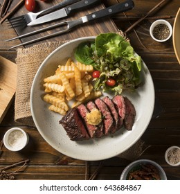 Topview, Medium Rare Grilled Marinated Beef Flank Steak On Plate