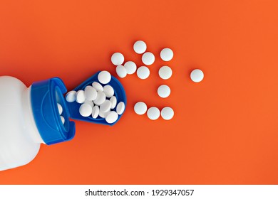 Topview Of Melatonin Tablets Flying From The Jar. Dietary Concept. Dietary Supplement Close-up