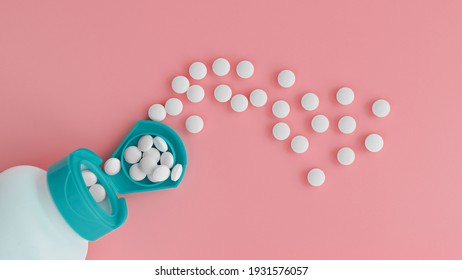 topview of melatonin tablets flying from the jar. dietary concept. dietary supplement close-up - Shutterstock ID 1931576057