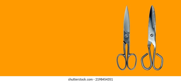 Topview Of Metal Scissors On Orange Background