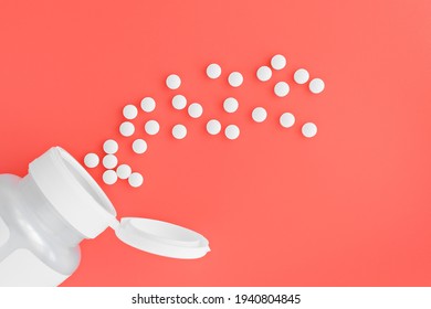 Topview Of Methyl Folate Tablets Flying From The Jar. Dietary Concept. Dietary Supplement Close-up