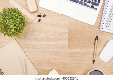 Topview Of Wooden Table With Office Tools And Plant. Mock Up