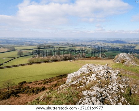 A Tor on Dartmoor in Devon made from volcanic breccia and pillow lavas and surmounted by the Church of St. Michael with views over Dartmoor National Park