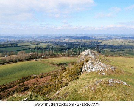 A Tor on Dartmoor in Devon made from volcanic breccia and pillow lavas and surmounted by the Church of St. Michael with views over Dartmoor National Park