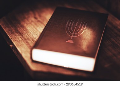 Torah Book Central Reference Of The Religious Judaic Tradition. Menorah Symbol On The Book Cover