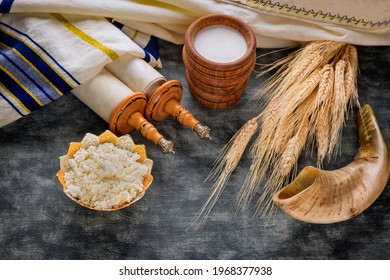 Torah and kippah on celebration traditional Jewish Holiday Shavuot for Kosher dairy product