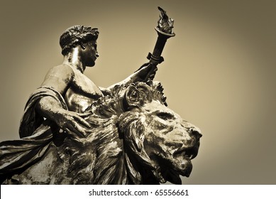 Torch Bearer And Lion Statue