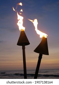 Torch fire overlooking sunset in Hawaii	
