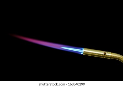 Torch tip & flame isolated in black - Powered by Shutterstock