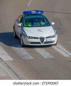 TORDESILLAS, VALLADOLID - 28 MARCH: Guardia Civil car in motion with two officers on March 28, 2015 in Tordesillas, Valladolid, Spain. Spanish Guardia Civil is a military force with police duties