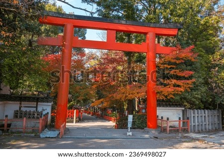 Torii red wooden gate Japan traditional in Shinto shrines temple entrance symbol of transition from the mundane to the sacred