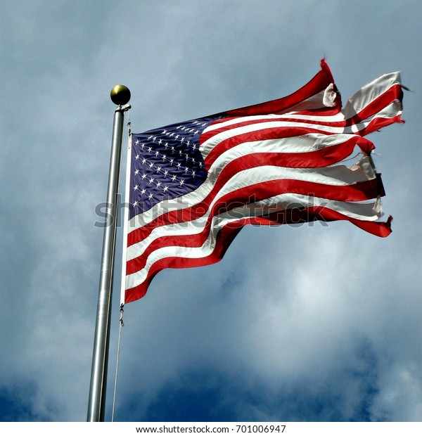 Torn American Flag Waving Wind Against Stock Photo (Edit Now) 701006947