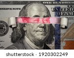 Torn bill revealing Chinese Yuan inside American Dollar. Ideas for Competition between China and USA, Risk of war, Taking over, Economy overtake, Changing world currency from US dollar to Chinese yuan