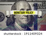Torn bills revealing Monetary Policy words. Ideas for Increase or Decrease interest rates, Stimulate the economy, Moneyless valuable