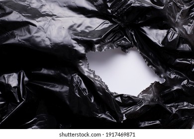 Torn Black Plastic Foil, Whole In A Black Plastic Film, Ripped Package