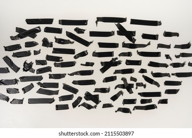 Torn Black Sticky Tape Of Different Sizes On A White Background