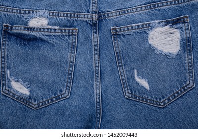 Torn Blue jeans with pocket background. back view
