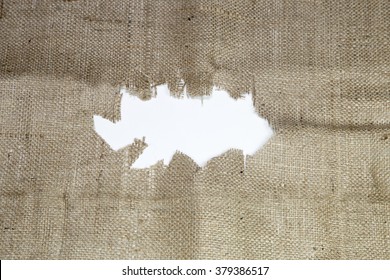 torn burlap with space for text showing a white background, weaving fabric