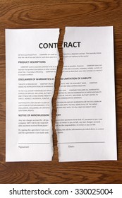 Torn Contract On Desk