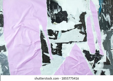 Torn And Crumpled Purple Poster Glued On Billboard With Old Dirty Paper. Abstract And Creative Background Of Ripped Magazine Paper.