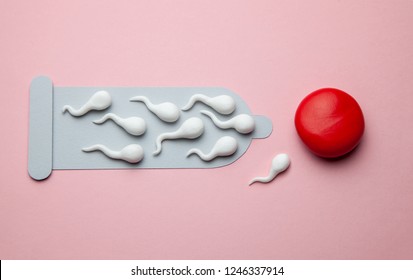Torn damaged condom and active condoms float to the egg. Unexpected pregnancy, egg fertilization