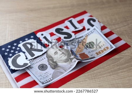 Torn dollar bill with American flag. Debt ceiling, stock market and financial concept.