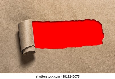 Torn Hole In Craft Paper With Red Copy Space