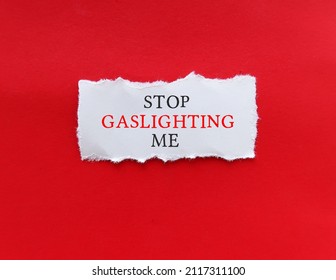 Torn Note On Red Background With Text STOP GASLIGHTING ME, To Stop Gaslighter, Abuser Who Tries To Control Victim By Twisting Their Sense Of Reality - Manipulation In Abusive Relationships