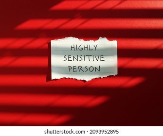 Torn Note Stick On Red Background With Text HIGHLY SENSITIVE PERSON, Refers To People Who Think And Feel Everything More Deeply, More Sensitive To The Environment And Social Interactions