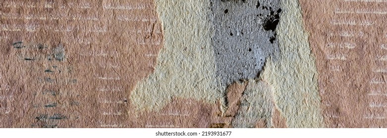 Torn Old Faded Paper Wallpaper With A Retro Pattern. Tattered Scraps Of Paper On A Concrete Wall. Vintage Texture For Background And Design. Closeup View With Copy Space.