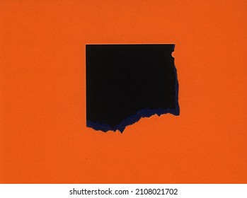 Torn Orange Paper With Black Hole Copy Space