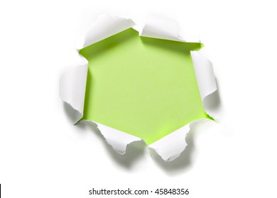 Torn Paper Circle On Green. Focus On Curled Edges Of Paper