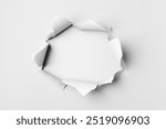 Torn paper hole background, white texture design. white torn paper, hole in center isolated on white background, space to insert text, torn ripped recycle paper for advertising content promotion.