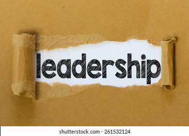 Torn paper with leadership word