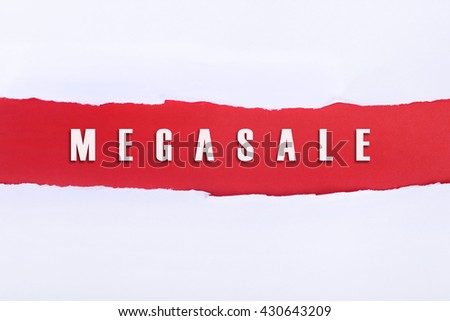 Torn paper with a MEGASALE word on red background.