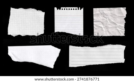 Torn Paper Notes Set on Black Background with Lined and Grid Sheets. Torn paper scraps on black: grid sheet, notebook, lined notebook page 
with crumpled, dotted paper, and ruled strip. Photo