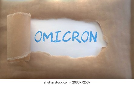 Torn Paper With Omicron Text. Concept Illustrating New Omicron Variant, Pandemic, Covid, Vaccine.