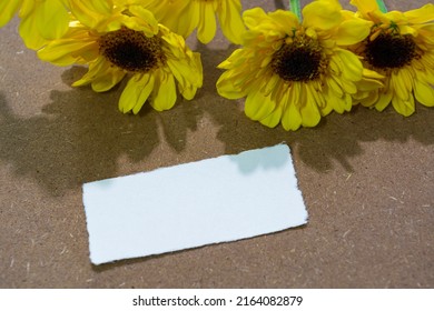 Torn Paper On Wooden Surface And Sunflower Flat Lay With Copy Space.