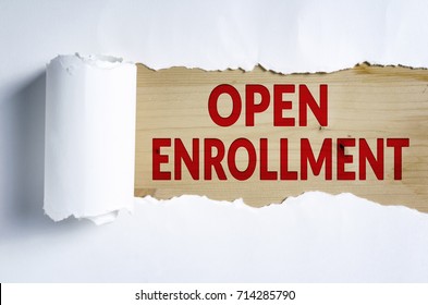Torn paper with OPEN ENROLLMENT in opening background