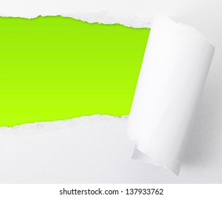 Torn paper sheet with an empty green colored gap hole as a copyspace background