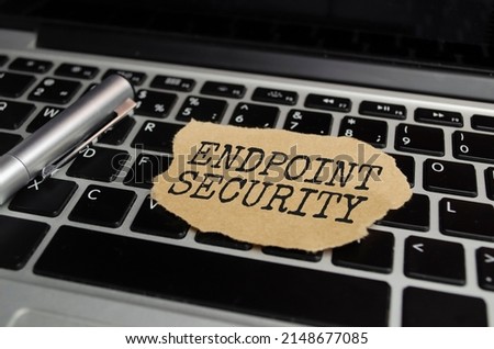 Torn paper strip on yellow background with text ENDPOINT SECURITY