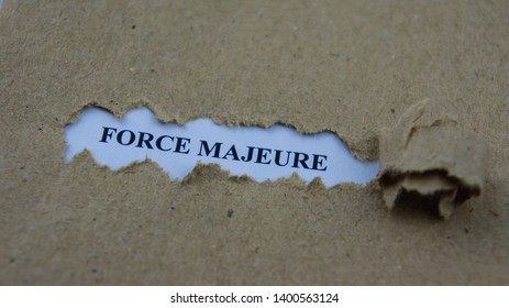Torn paper with text force majeure. Legal term mean unforeseeable circumstances that prevent someone from fulfilling a contract. - Shutterstock ID 1400563124