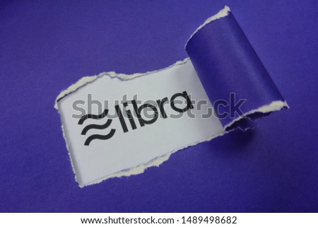Torn paper with text Libra. Libra cryptocurrency. New cryptocurrency. Calibra is a new digital wallet for a new digital currency Libra.