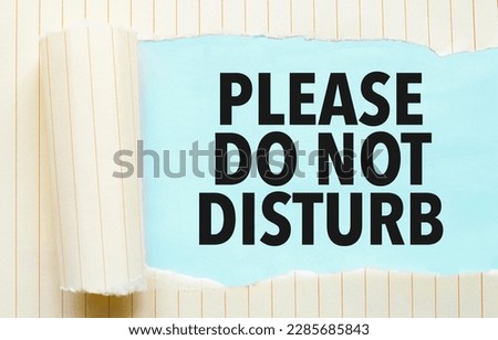 torn paper with text please do not disturb and blue background